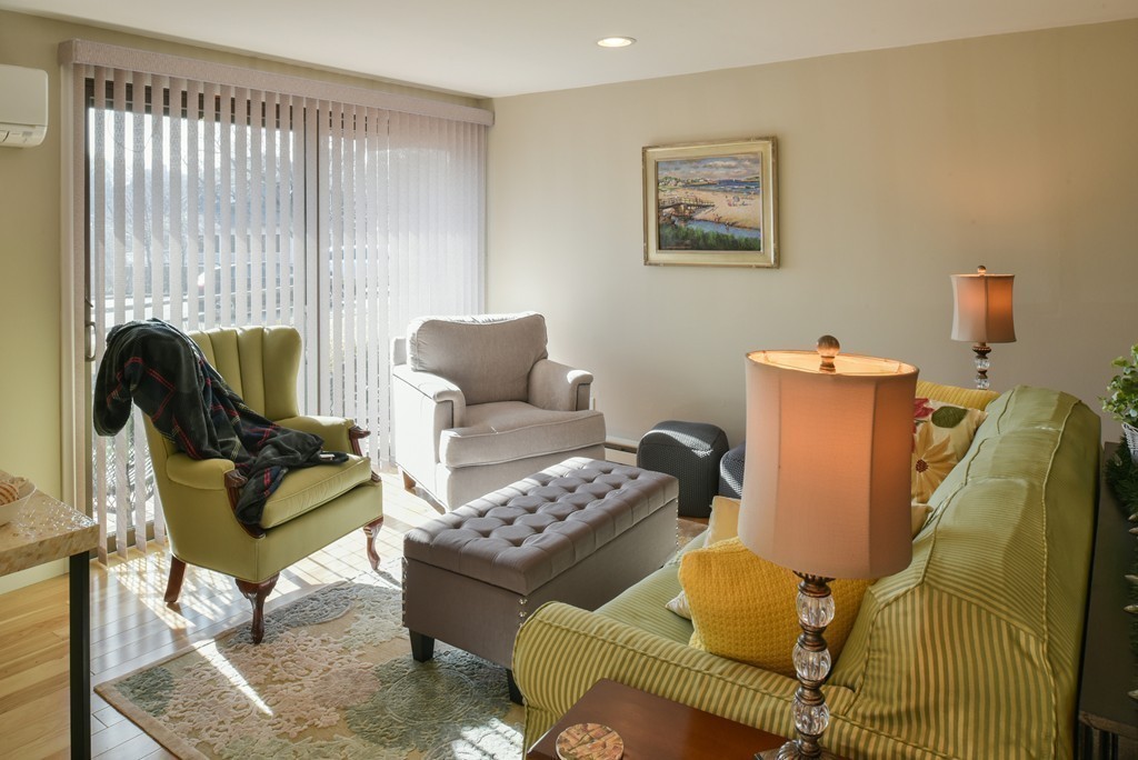 18 Atlantic Road, Unit 35 Gloucester, MA 01930 - Photo 8 of 24 a living room with furniture and a window