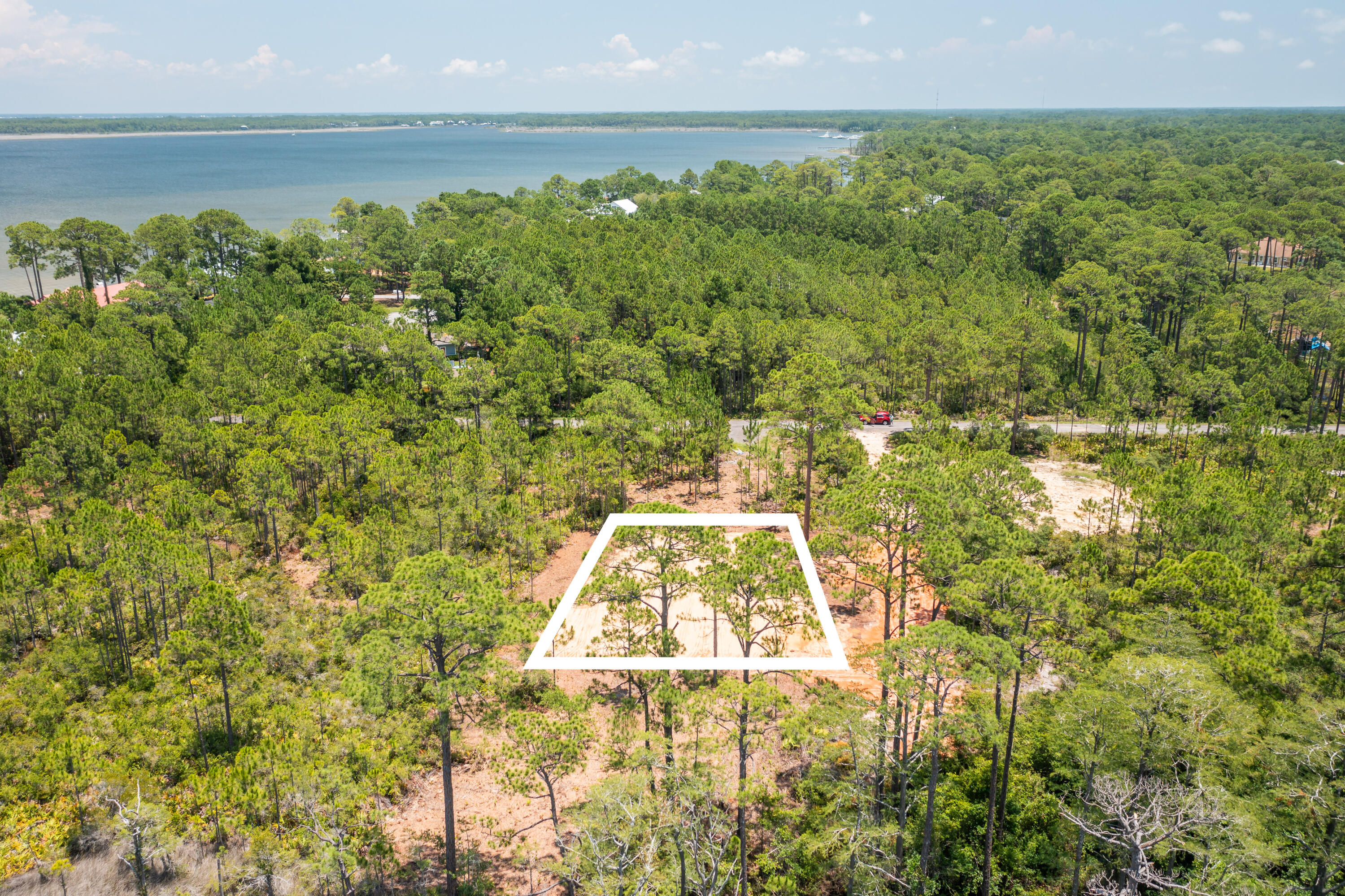 Lot 2-blk Lot 2-blk F Exclusive Beach Santa Rosa Beach, FL 32459 - Photo 14 of 22 a view of a yard with an outdoor space and seating area