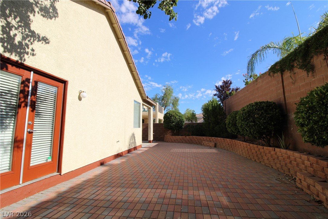 754 Rise Canyon Drive Henderson, NV 89052 - Photo 32 of 34 This outdoor space offers a private retreat with durable brick pavers and thoughtfully designed landscaping.