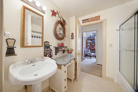 a bathroom with a sink and a mirror