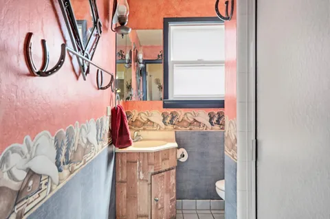 a balcony with table and chairs