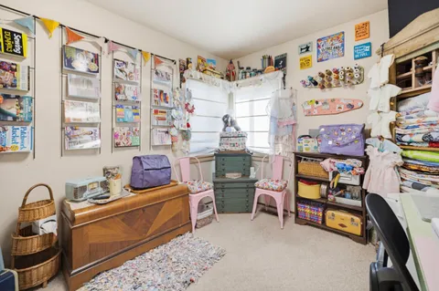 a room with furniture and a baby crib