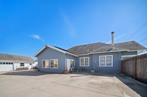 a front view of a house with yard