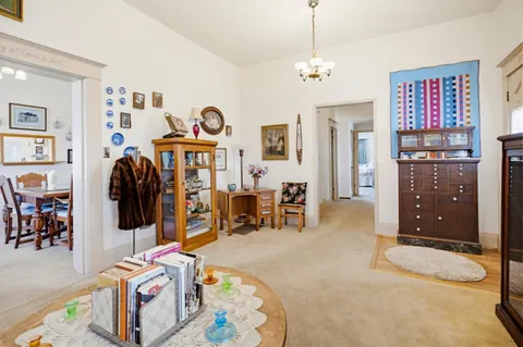 a bedroom with furniture and a chandelier