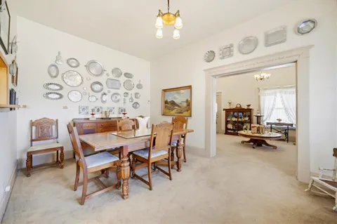 a view of a livingroom with furniture and a chair