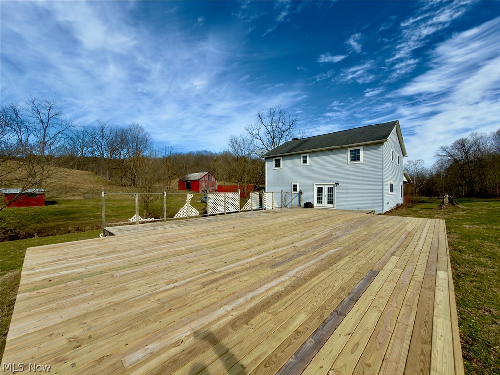 17377 Murphy Road Amesville, OH 45711 - Photo 30 of 43 Deck with a lawn, french doors, and an outdoor structure