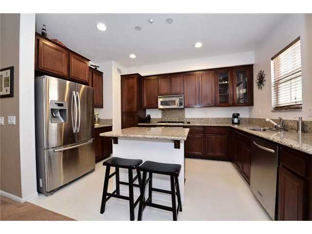 2252 Huntington Point Road, Unit 84 Chula Vista, CA 91914 - Photo 1 of 17 Gorgeous Kitchen with LARGE ISLAND, GRANITE COUNTERS, and Beautiful CHERRY CABINETS!