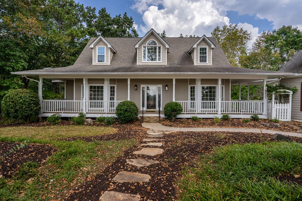 1265 Hunters Ridge Jasper, GA 30143 - Photo 1 of 50 a front view of a house with garden