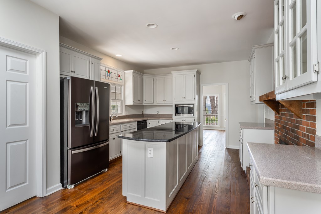 1265 Hunters Ridge Jasper, GA 30143 - Photo 11 of 50 a kitchen with stainless steel appliances granite countertop a refrigerator a sink dishwasher a stove and a refrigerator with wooden floor