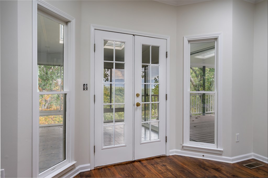 1265 Hunters Ridge Jasper, GA 30143 - Photo 17 of 50 a view of a bedroom with wooden floor and windows