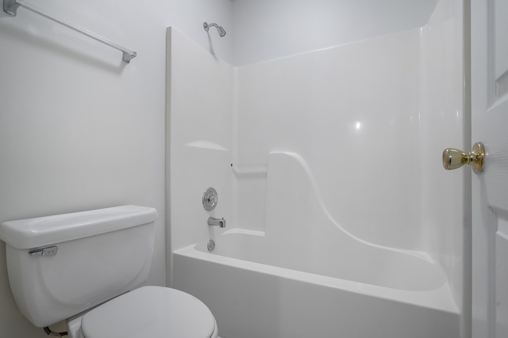 1265 Hunters Ridge Jasper, GA 30143 - Photo 32 of 50 a white toilet sitting next to a bath tub