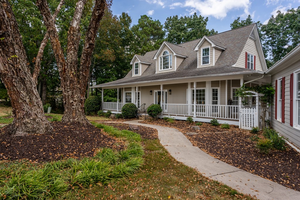 1265 Hunters Ridge Jasper, GA 30143 - Photo 44 of 50 a front view of a house with a garden