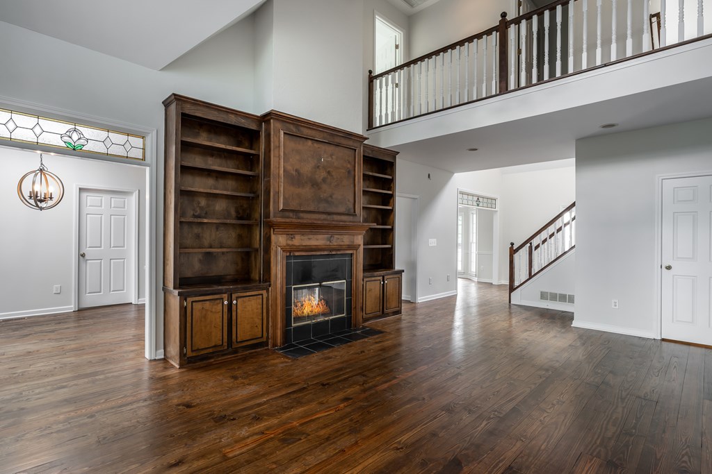 1265 Hunters Ridge Jasper, GA 30143 - Photo 6 of 50 a view of an empty room with wooden floor and a window