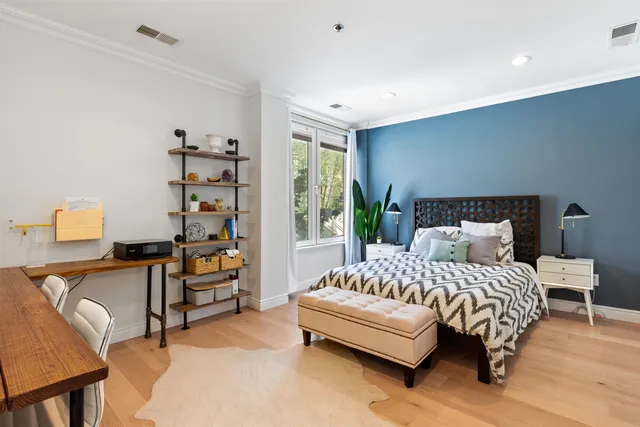 a bedroom with a bed and a couch