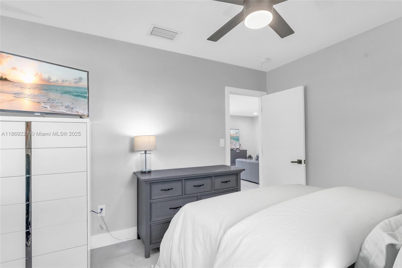 6490 Southwest 37th Street Miami, FL 33155 - Photo 16 of 23 a bedroom with a bed and a painting on the wall