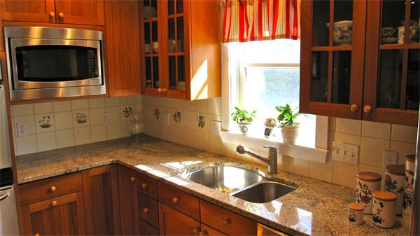 9 Glendale Road Marblehead, MA 01945 - Photo 2 of 13 a kitchen with granite countertop a sink and a stove