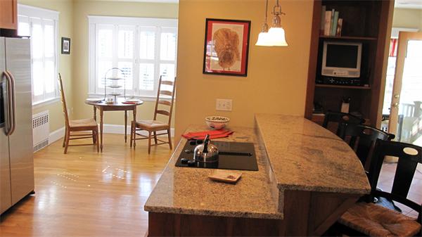 9 Glendale Road Marblehead, MA 01945 - Photo 4 of 13 a dining room with table chairs and kitchen view