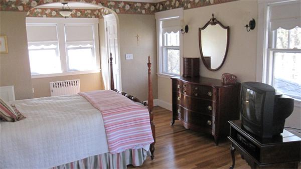 9 Glendale Road Marblehead, MA 01945 - Photo 8 of 13 a bedroom with bed and wooden floor