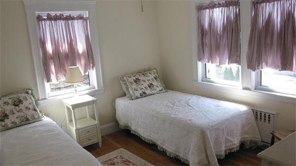 9 Glendale Road Marblehead, MA 01945 - Photo 9 of 13 a bedroom with a bed and a window