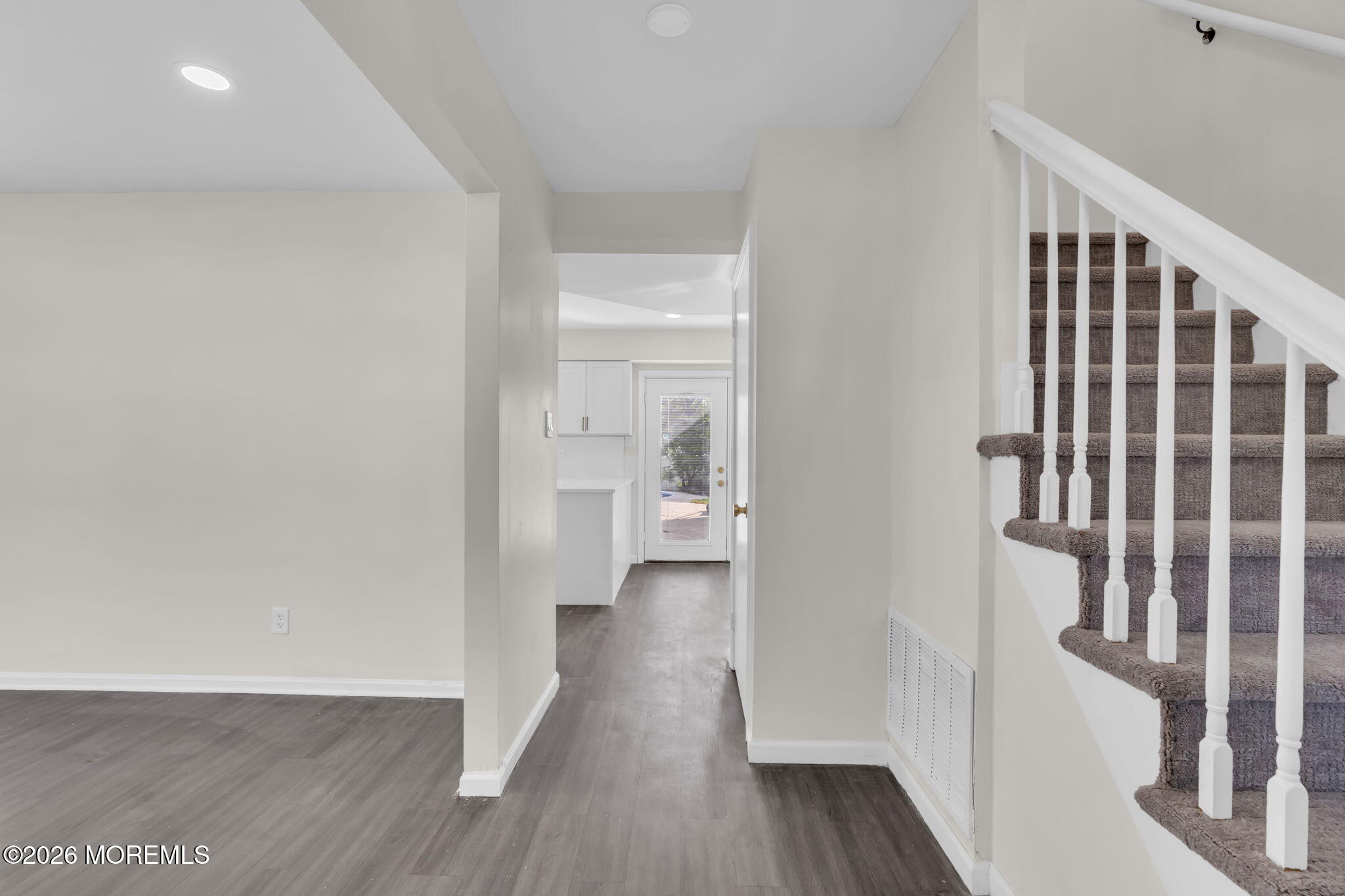 45 Peachstone Road Howell, NJ 07731 - Photo 9 of 54 a view of a hallway with wooden floor