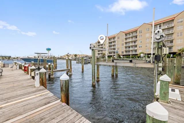 an aerial view of a swimming pool with outdoor seating