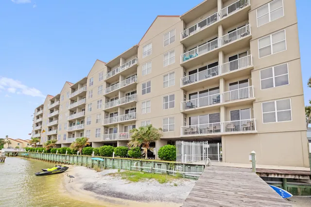 a view of swimming pool with outdoor seating and a garden