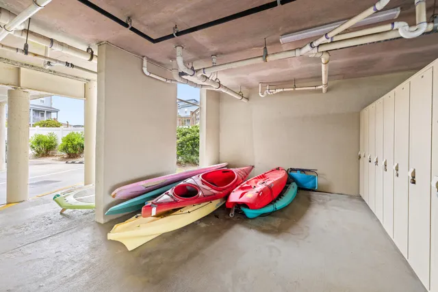 a kitchen with refrigerator and cabinets