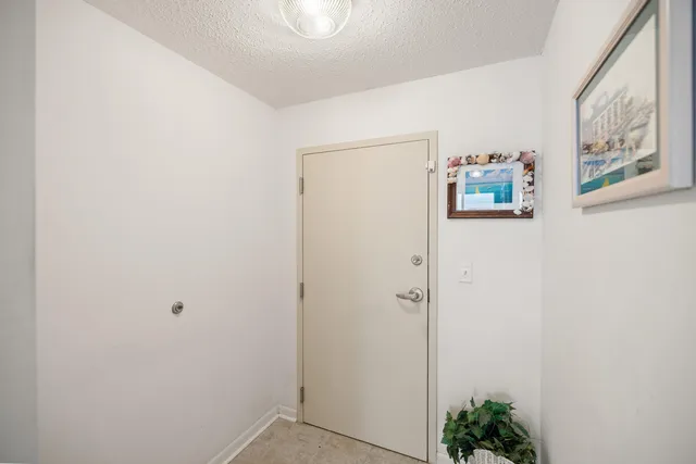 a living room with furniture a flat screen tv and a dining table with wooden floor