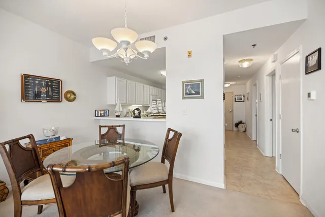 a white toilet sitting next to a bathroom sink and a shower