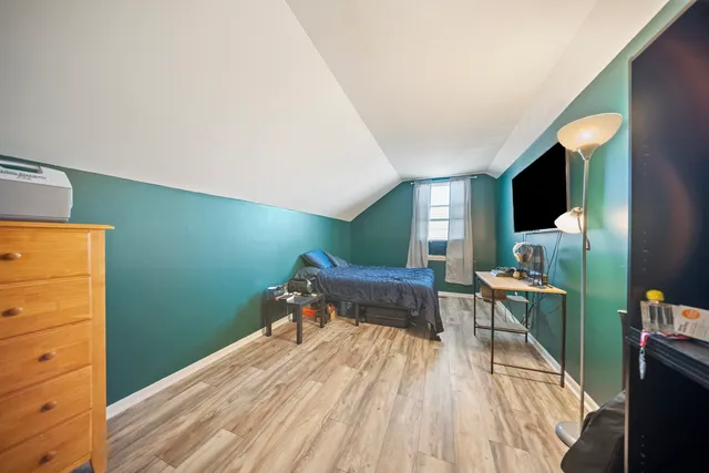 a room with furniture and a flat screen tv