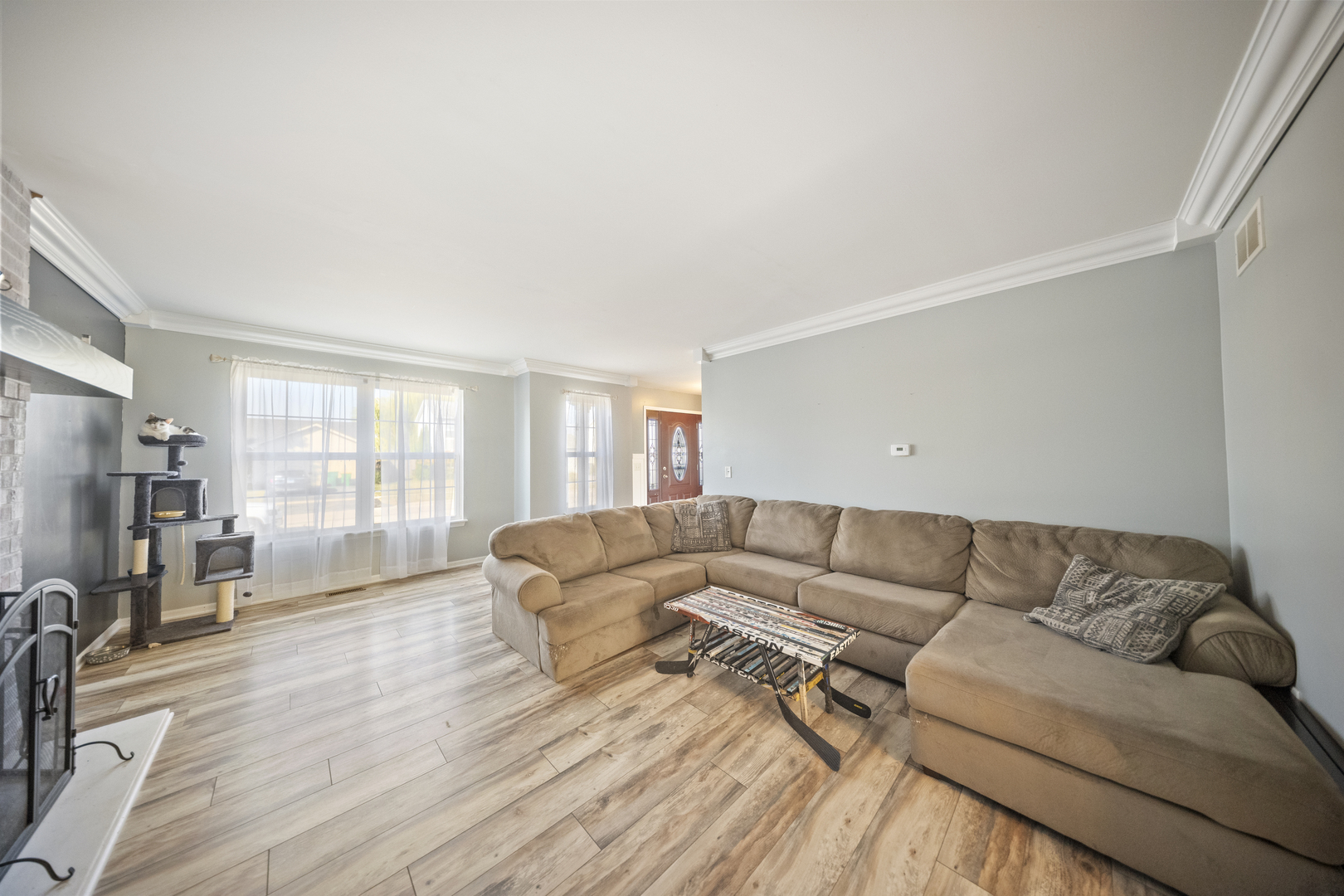 1016 Misty Landing Court Malta, IL 60150 - Photo 2 of 30 a living room with furniture and a flat screen tv