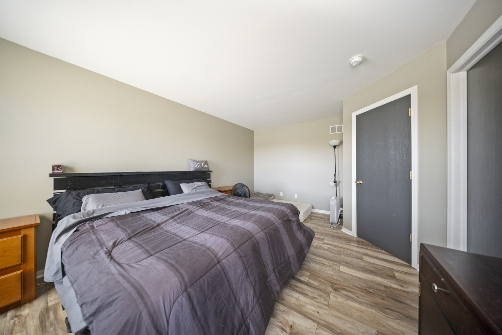 1016 Misty Landing Court Malta, IL 60150 - Photo 21 of 30 a bedroom with a bed and wooden floor