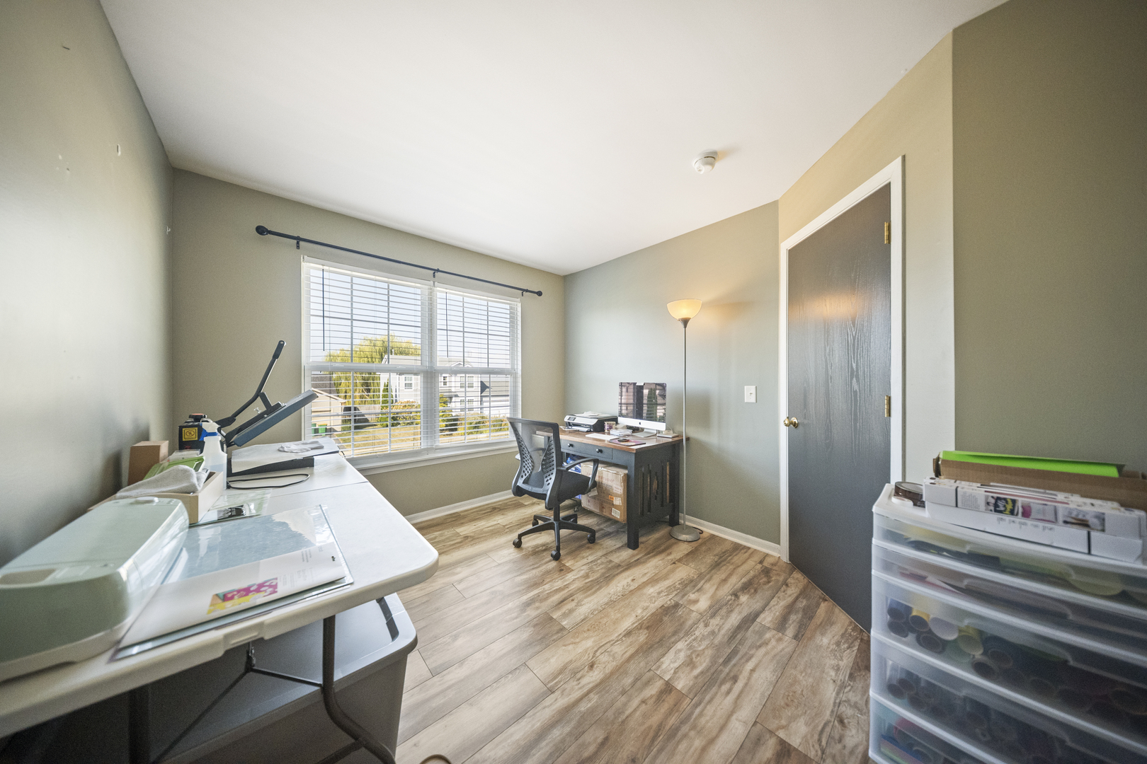 1016 Misty Landing Court Malta, IL 60150 - Photo 23 of 30 a view of a workspace with furniture and a window