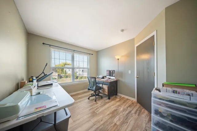 a workspace with furniture and window