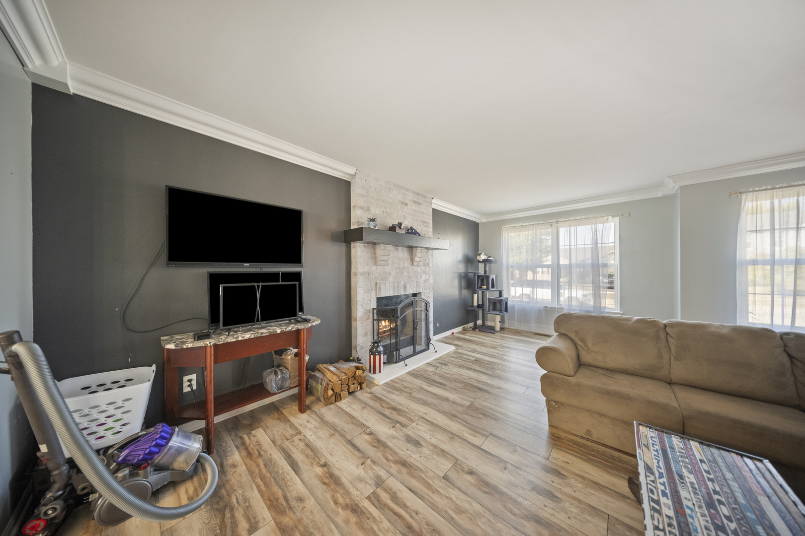1016 Misty Landing Court Malta, IL 60150 - Photo 3 of 30 a living room with furniture and a flat screen tv