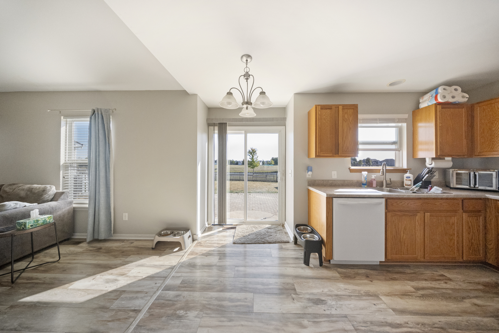 1016 Misty Landing Court Malta, IL 60150 - Photo 5 of 30 a living room with granite countertop furniture and a chandelier