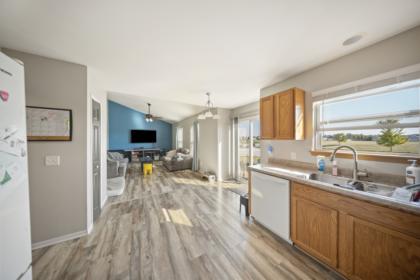 1016 Misty Landing Court Malta, IL 60150 - Photo 6 of 30 a kitchen with a sink and wooden floor