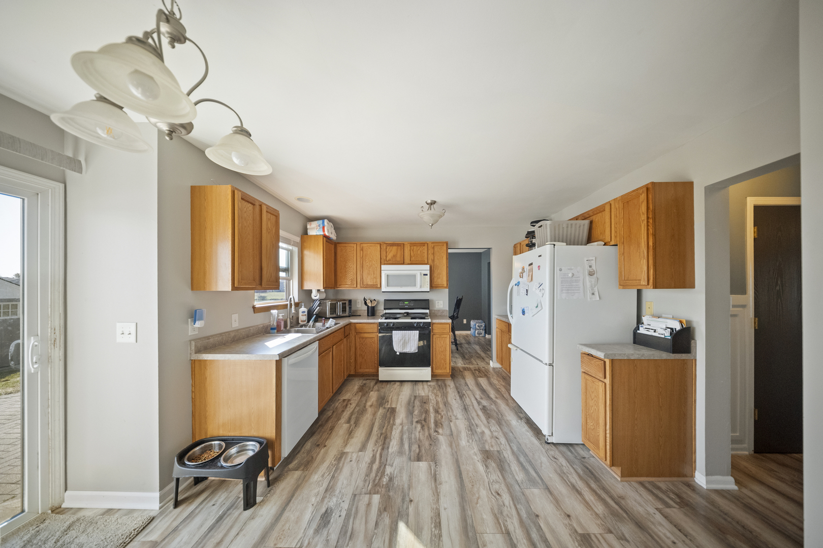 1016 Misty Landing Court Malta, IL 60150 - Photo 8 of 30 a kitchen with stainless steel appliances granite countertop a refrigerator and a stove top oven