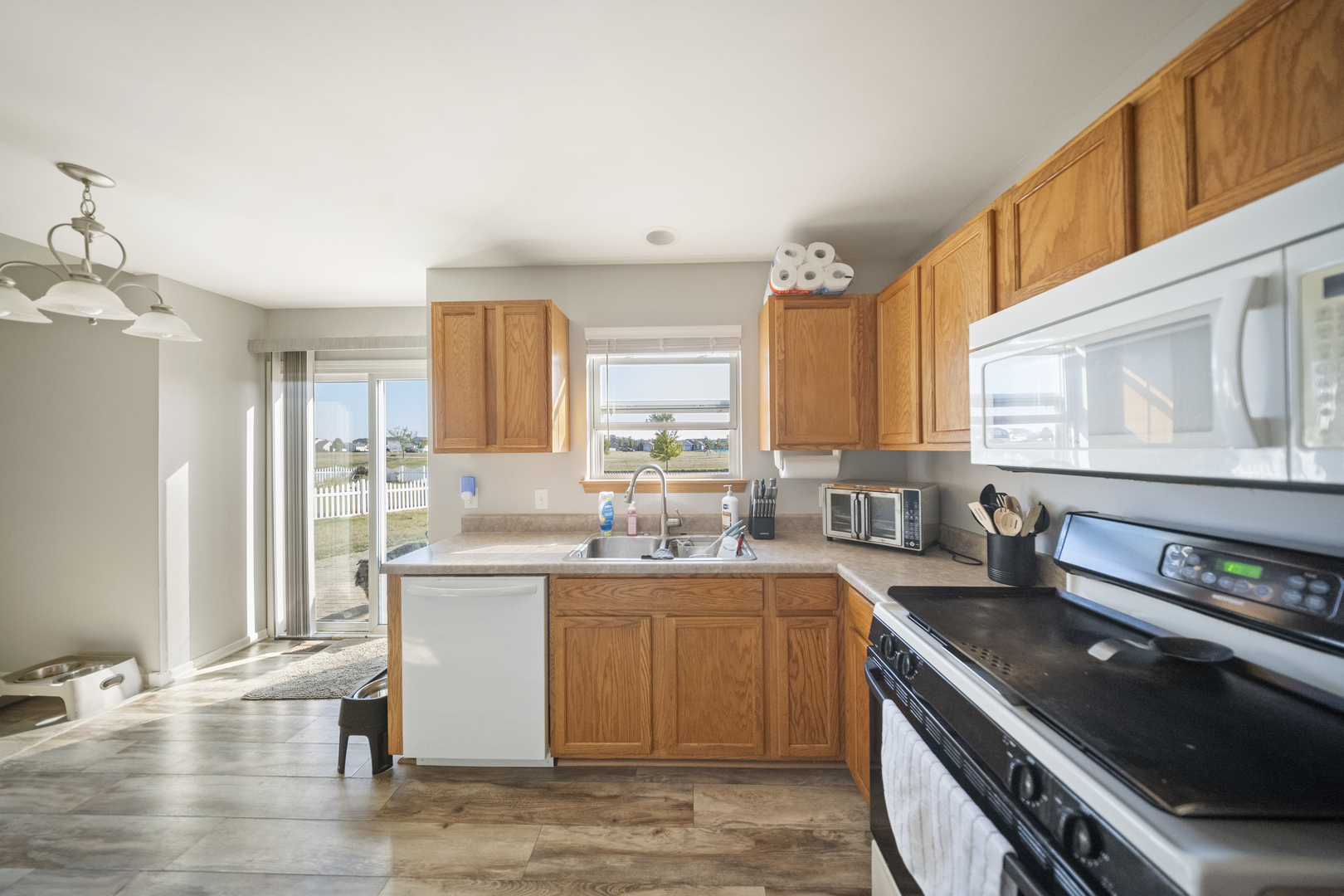 1016 Misty Landing Court Malta, IL 60150 - Photo 9 of 30 a kitchen with a sink appliances cabinets and a counter top space
