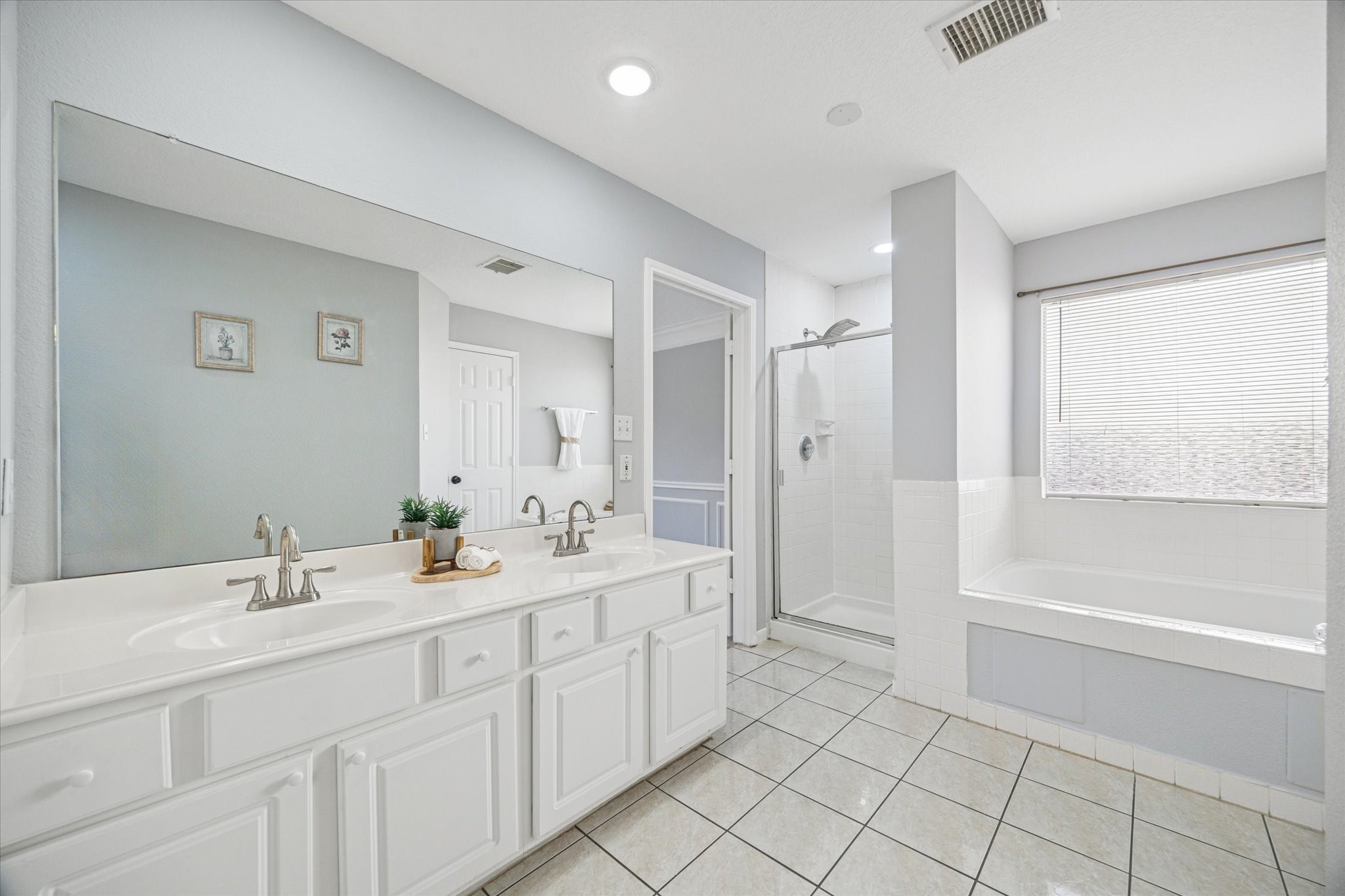 3414 Sapling Oak Drive Houston, TX 77082 - Photo 7 of 12 a spacious bathroom with a shower a sink and a mirror