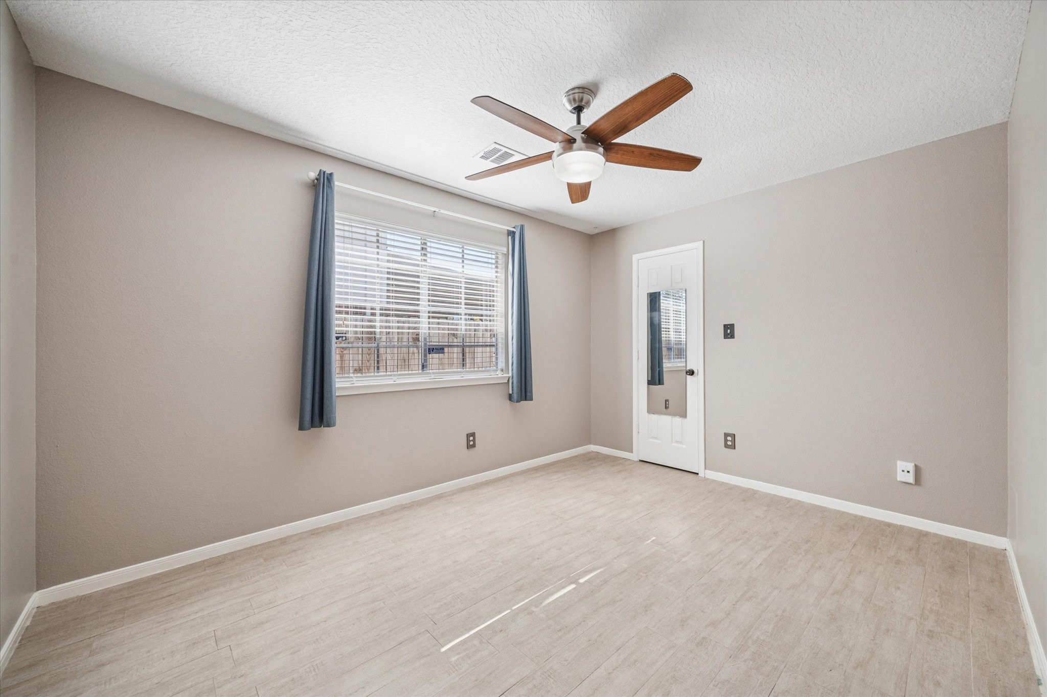 3414 Sapling Oak Drive Houston, TX 77082 - Photo 8 of 12 a view of an empty room with a window
