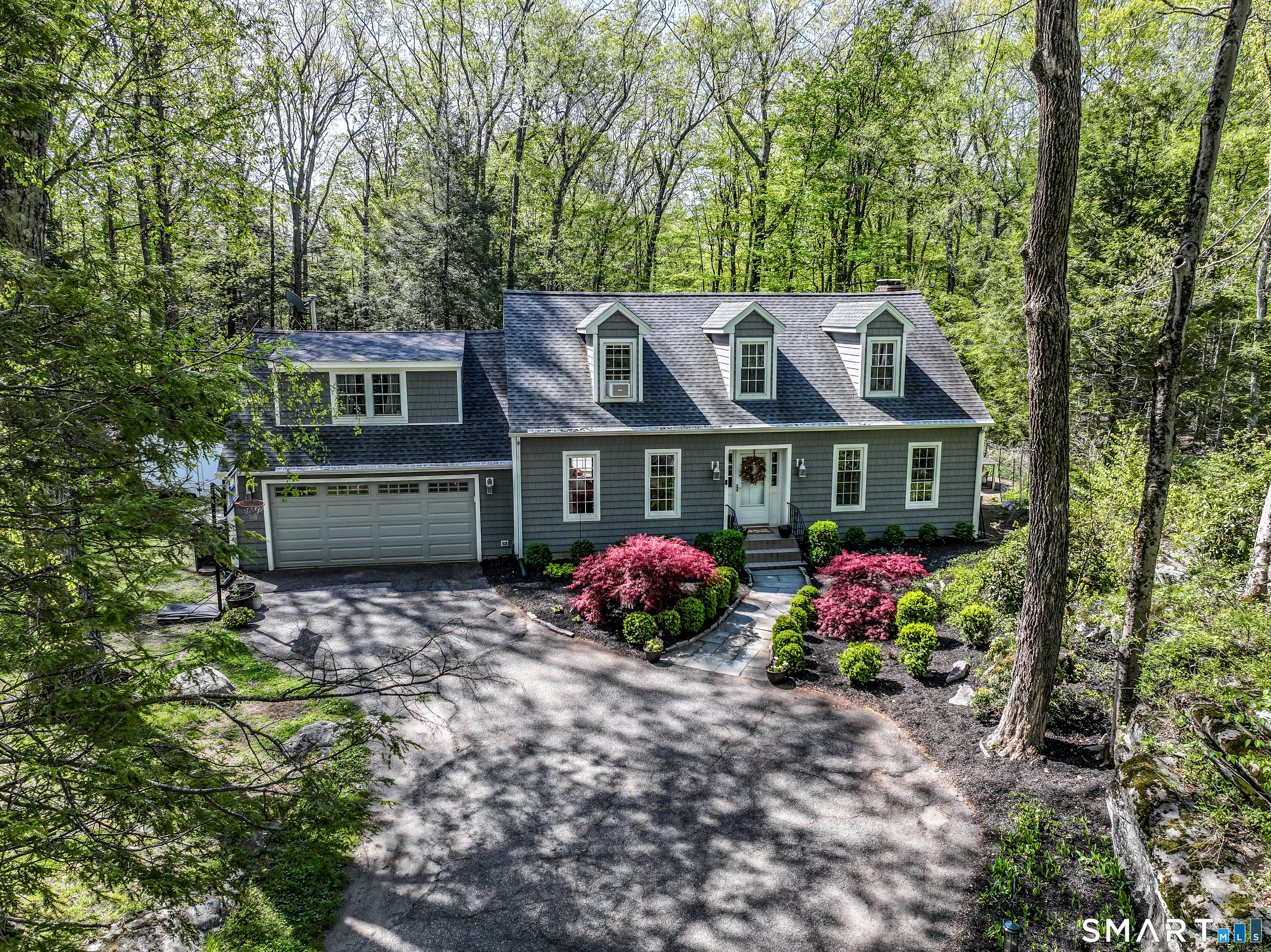 20 Puritan Valley Road Brookfield, CT 06804 - Photo 33 of 35 a house view with a seating space and garden