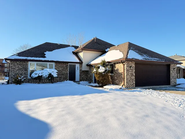a front view of a house with yard