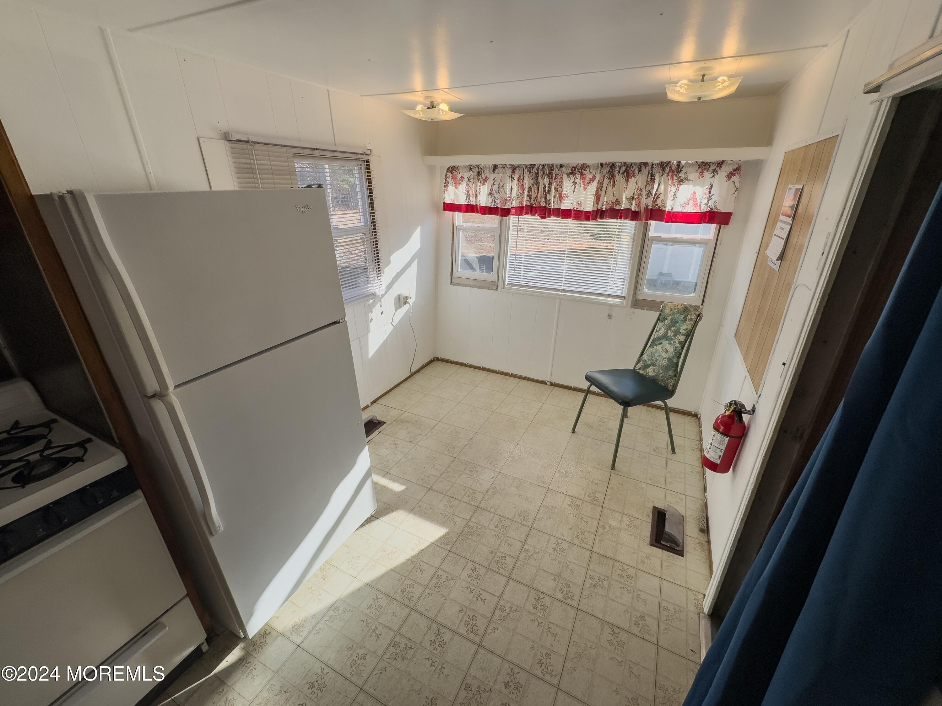 273 Toms River Road Jackson, NJ 08527 - Photo 34 of 43 a white refrigerator freezer and a stove sitting inside of a kitchen