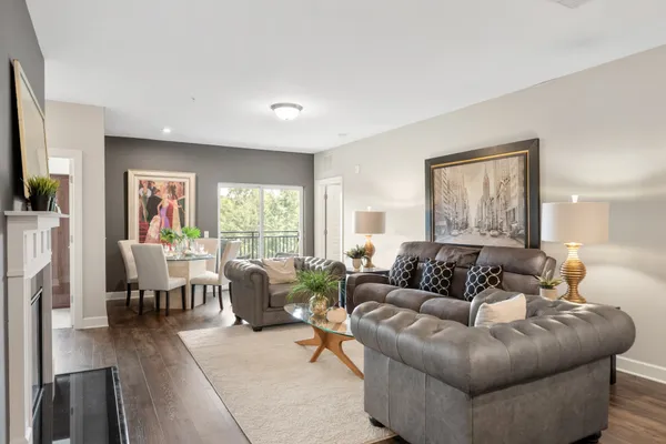 a living room with furniture and a large window
