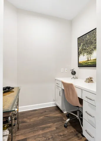 a workspace with furniture and wooden floor