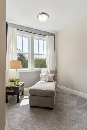 a bedroom with bed and a window