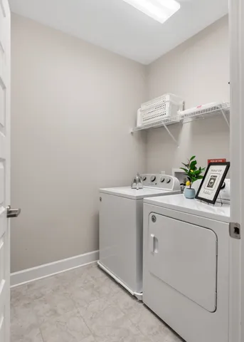 a utility room with dryer and washer