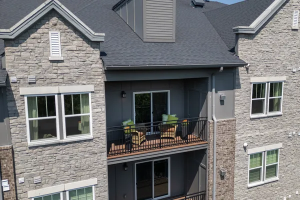 a front view of a house with large windows