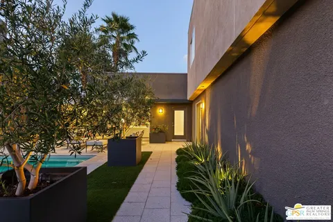 a kitchen with stainless steel appliances granite countertop a sink and a stove